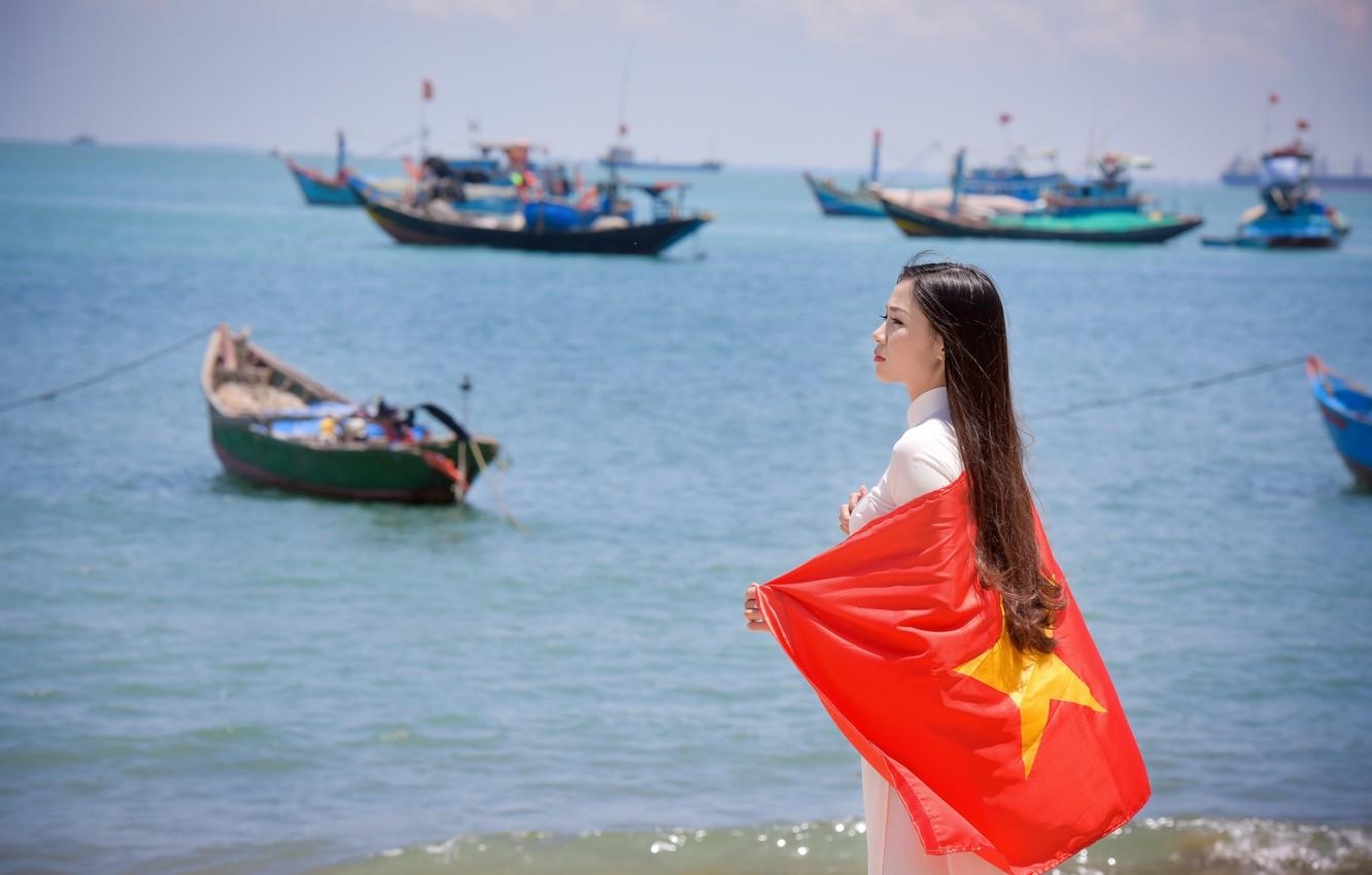 1340x850 Wallpaper sea, summer, girl, face, dress, flag, Vietnam image, Desktop