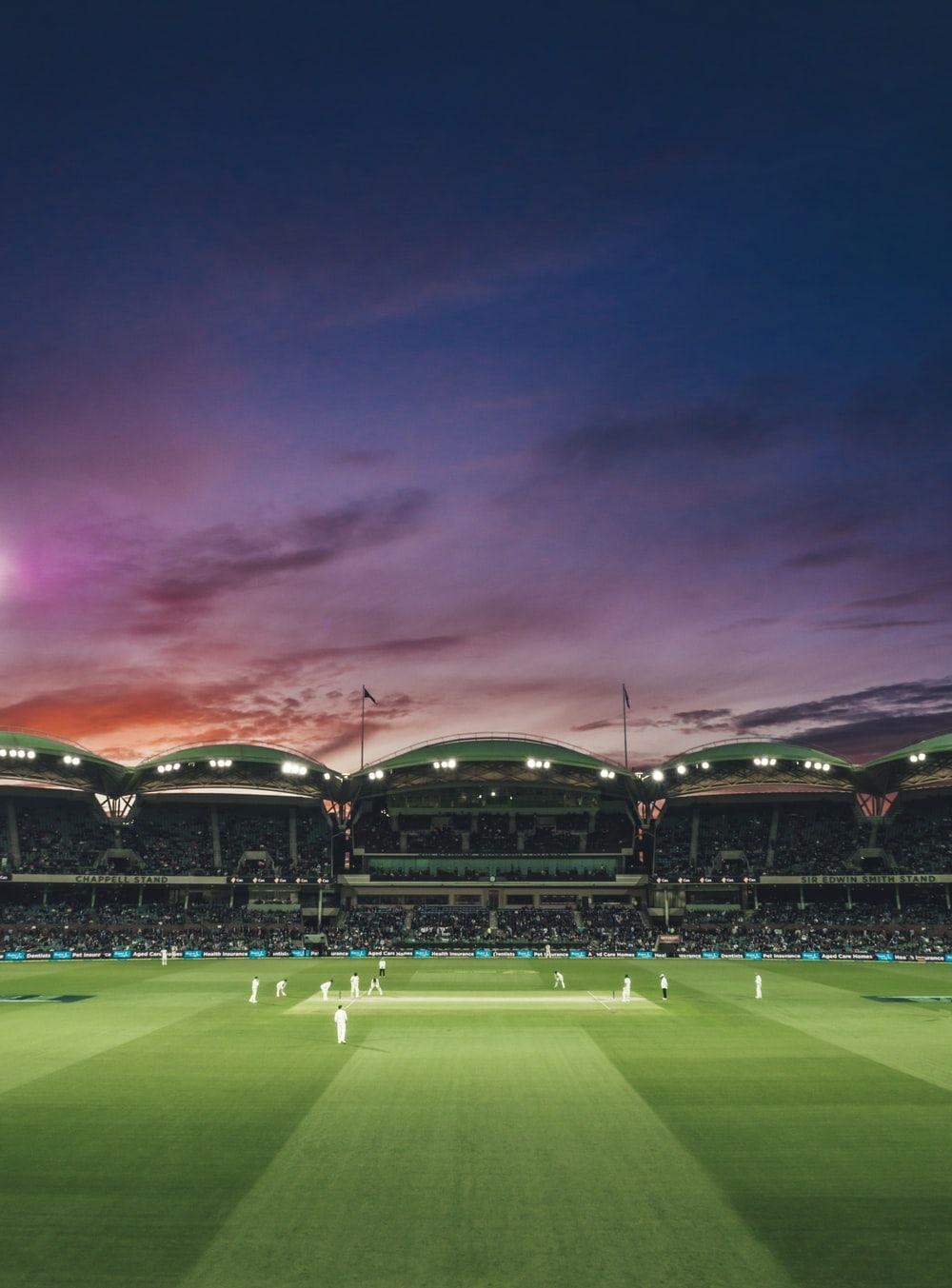 1000x1360 people watching game of cricket during sunset photo, Phone