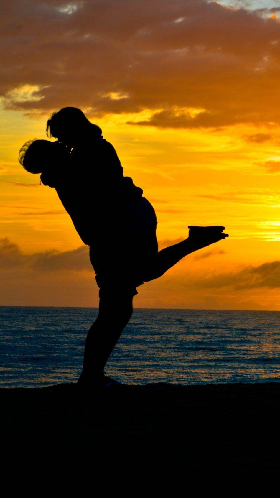 950x1690 Couple Romantic Kiss Sea Sunset Silhouette 4K Ultra HD Mobile Wallpaper. Sunset silhouette, Love wallpaper romantic, Romantic kiss, Phone