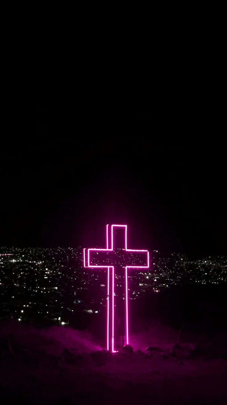 740x1310 Download A Pink Cross On A Hill With A City In The Background Wallpaper, Phone