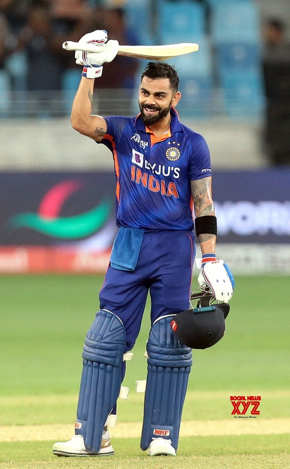 930x1500 Dubai:India's Virat Kohli raises his bat to celebrate scoring a century. #Gallery News XYZ, Phone