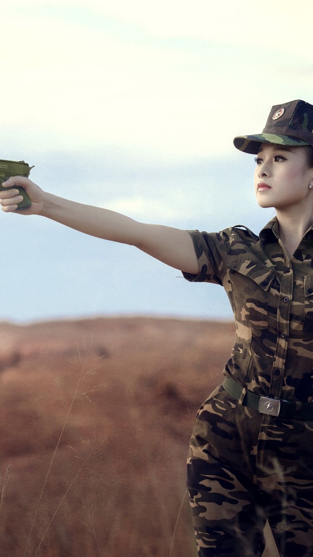 1080x1920 iPhone Wallpaper Female Soldier, Asian Girl, Use Gun, Phone