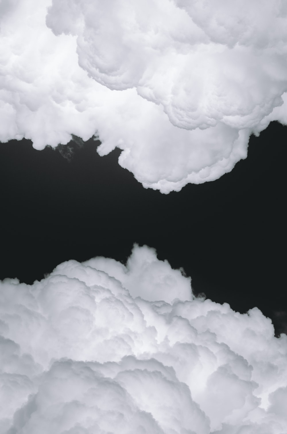 1000x1510 White clouds on black background photo, Phone