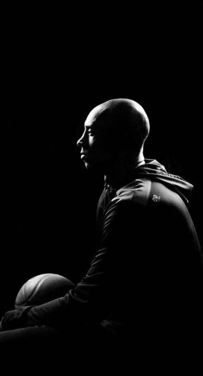 700x1300 black and white photo of kobe sitting holding a basketball photographed from the side kobe wallpaper. Kobe bryant, Kobe bryant wallpaper, Kobe bryant picture, Phone