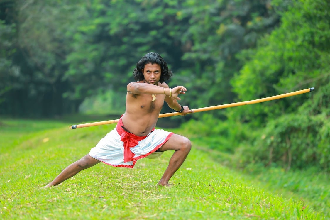 1130x750 A Man Doing Silambam · Free, Desktop