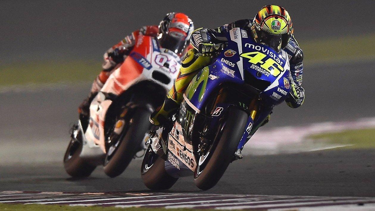 1260x710 Valentino Rossi Andrea Dovizioso battle MotoGP Qatar 2015, Desktop