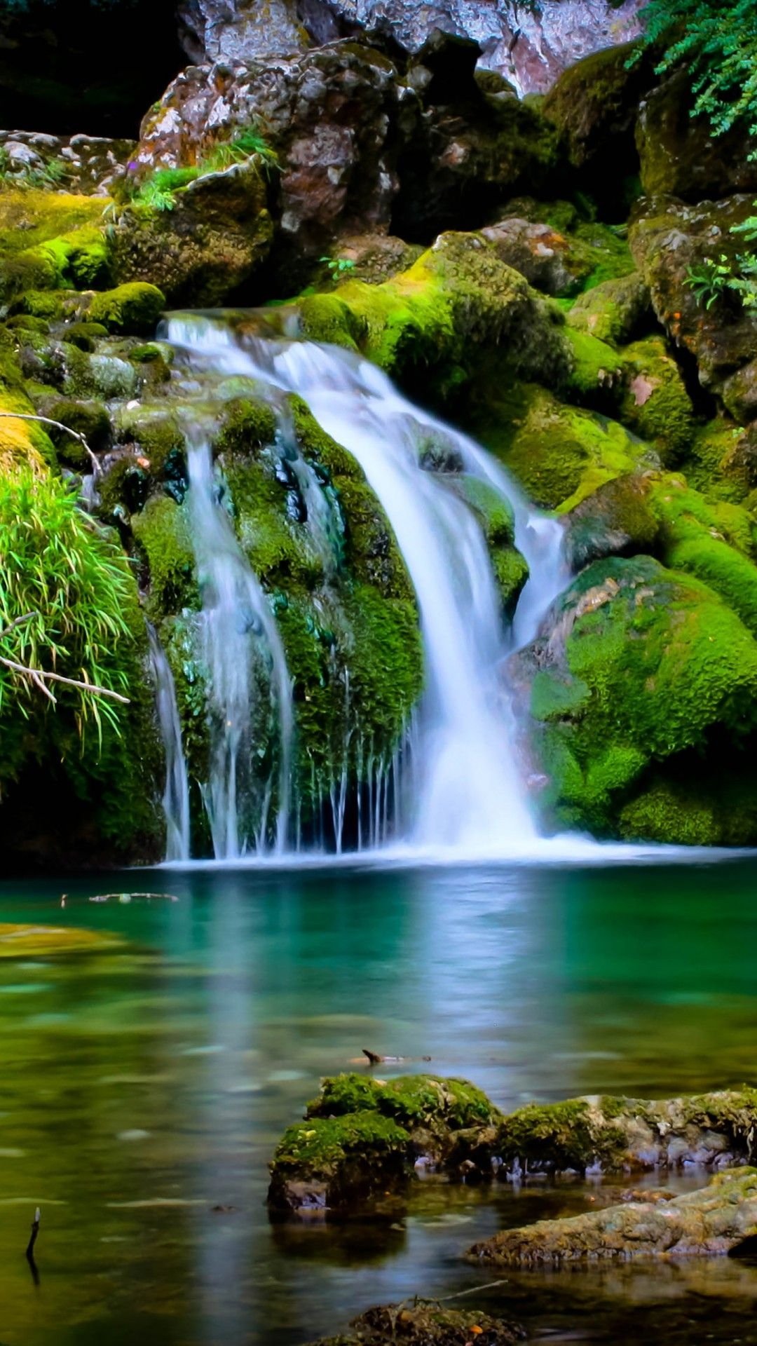 1080x1920 Green Covered Rocks With Green Trees Between Waterfall 4K HD Nature Wallpaper, Phone