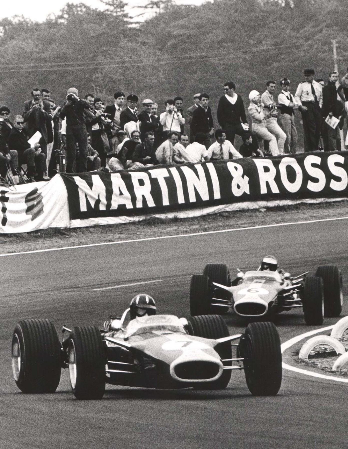 1400x1800 Jim Clark and Graham Hill dueling in their Lotus 49s during the 1967, Phone