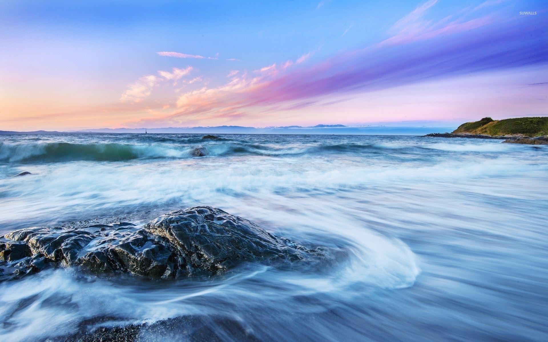 1920x1200 Shiny rock on the beach facing the ocean waves wallpaper, Desktop