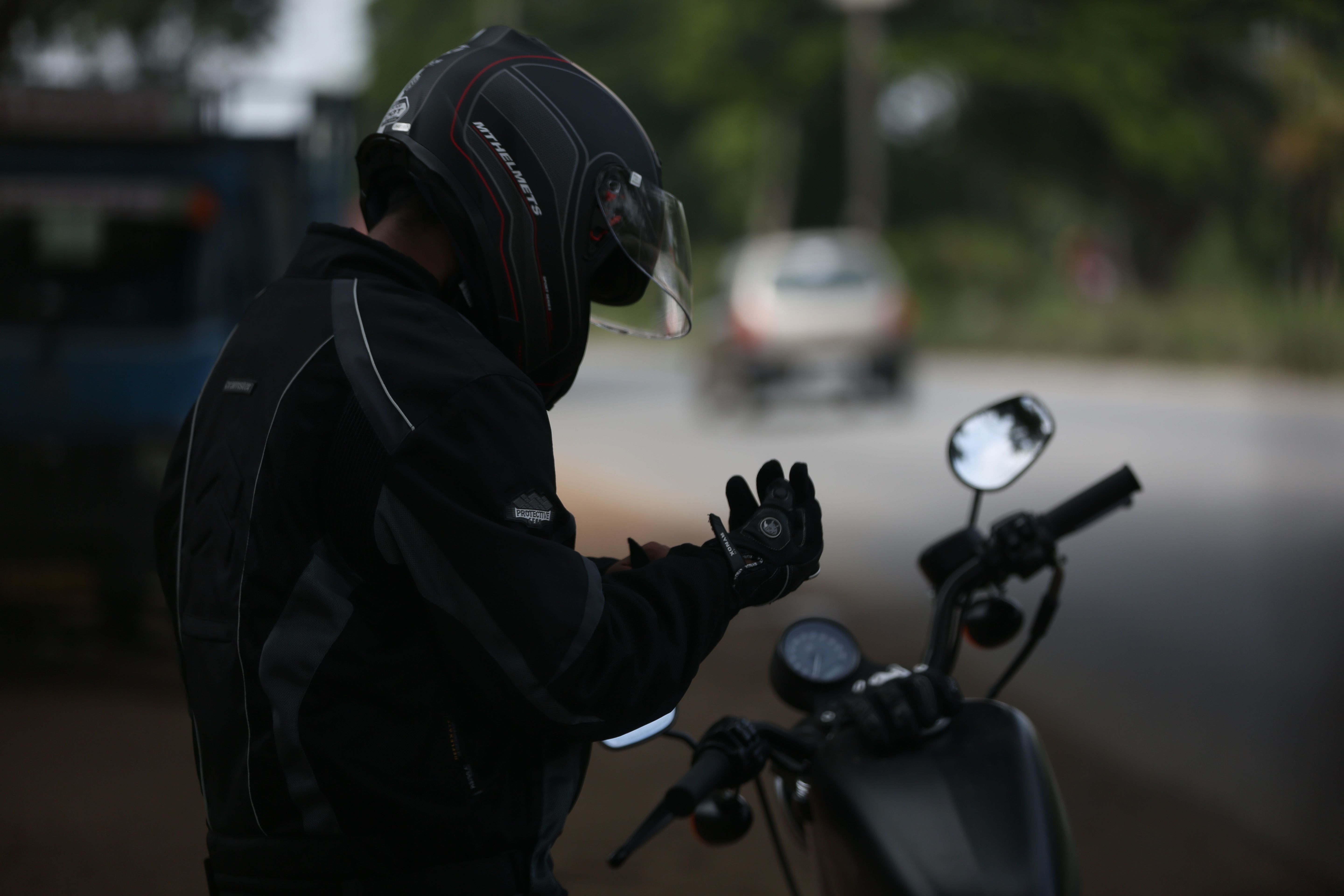 5760x3840 Sselective Photo Of Man Wearing Black Jacket And Full Face Helmet While Standing Near Motorcycle Free Image, Desktop