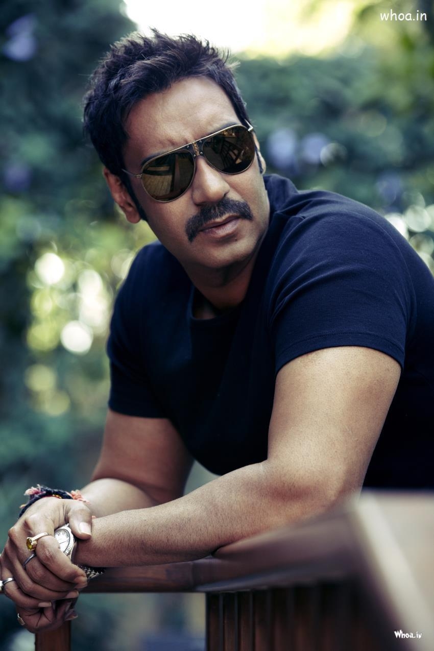 850x1280 Ajay Devgan Black Sunglass With Black T Shirt HD Bollywood Wallpaper, Phone