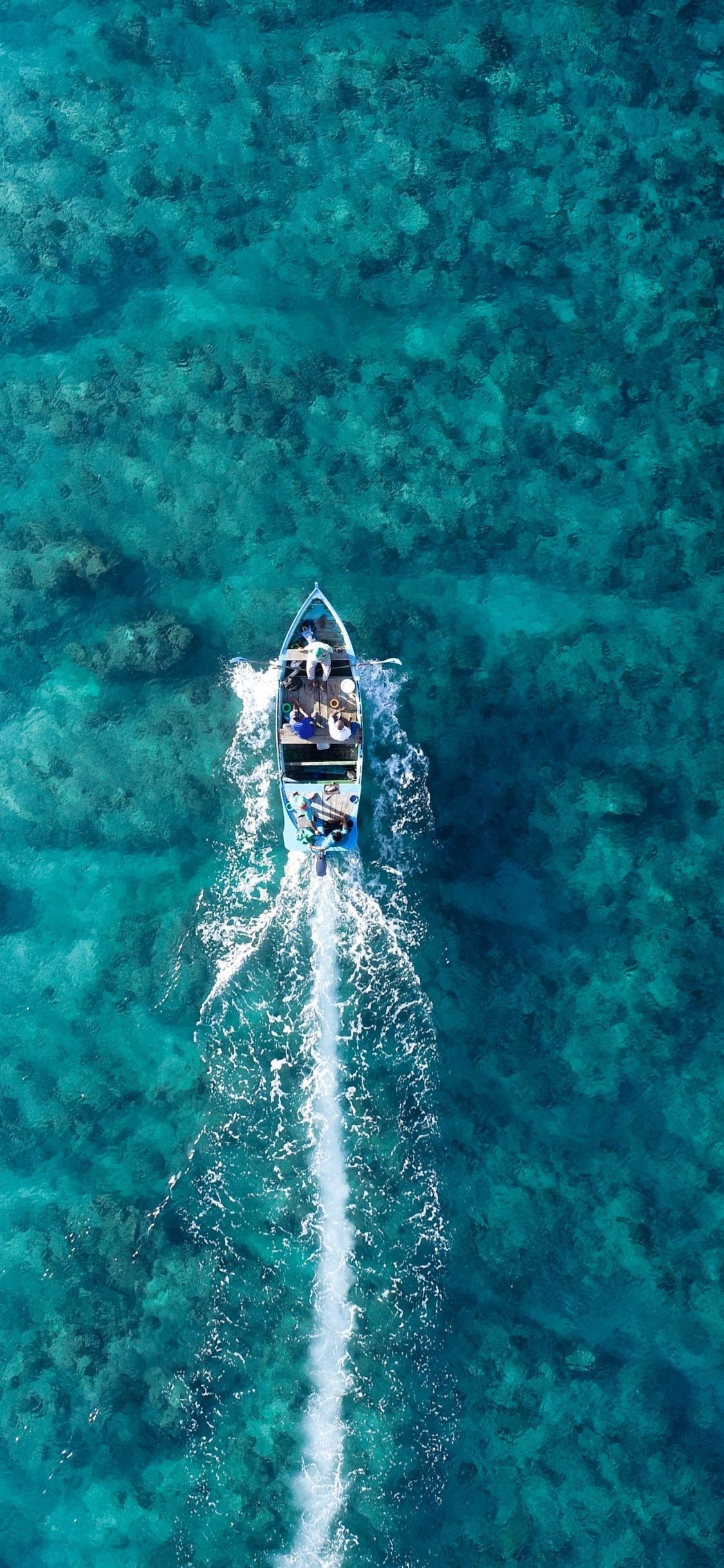 1130x2440 Download  wallpaper boat, holiday, blue sea, aerial view, Phone