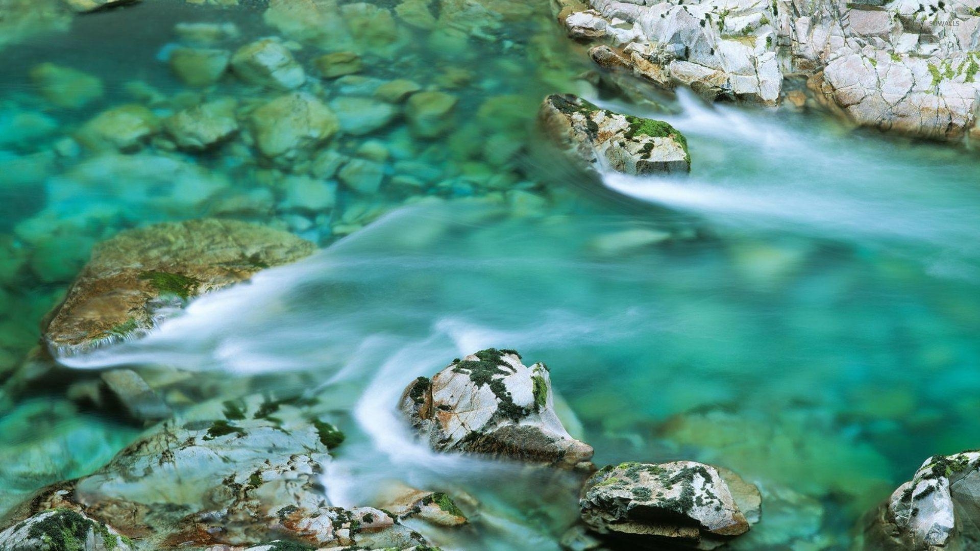 1920x1080 Clear water river washing the mossy rocks wallpaper, Desktop