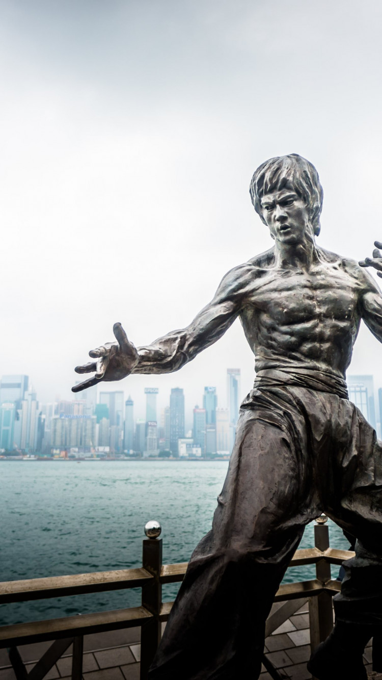 750x1340 Download wallpaper: Bruce Lee statue from Hong Kong, Phone