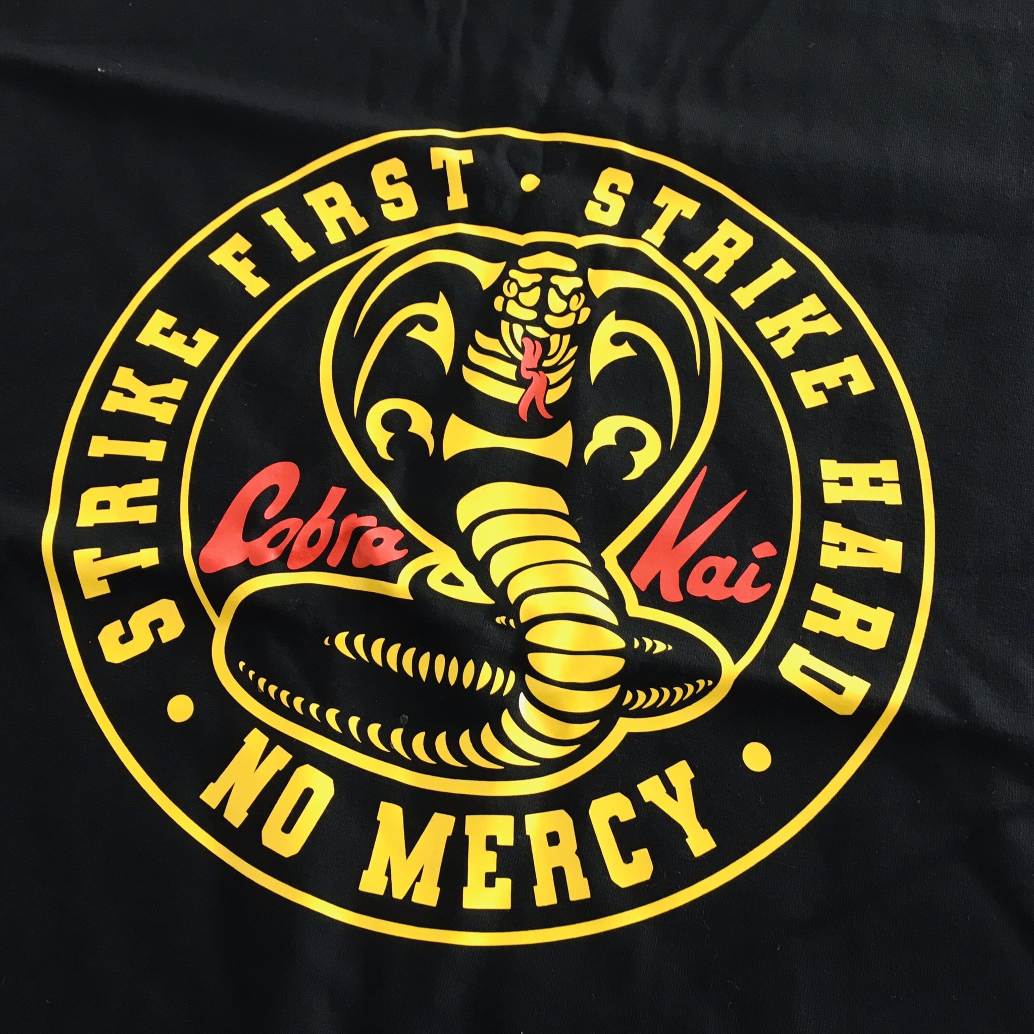 2050x2050 TeLaHagoComoQuieras first, Strike hard, No mercy (Cobra Kai). #strikefirststrikehardnomercy #karatekid #daniellarusso #miyagido #johnnylawrence #cobrakai #tlhcq #estampa #estampado #estampada #remera #remeraestampada, Phone