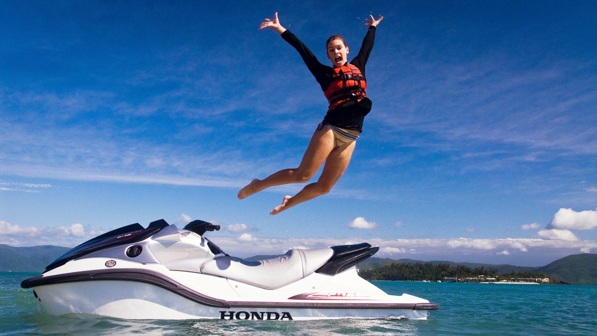 1920x1080 High Definition Wallpaper Of A Woman Jumping Out Of A Jetski, Desktop