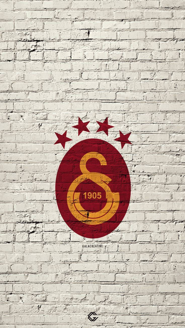 740x1310 Download Galatasaray Logo On White Brick Wallpaper, Phone