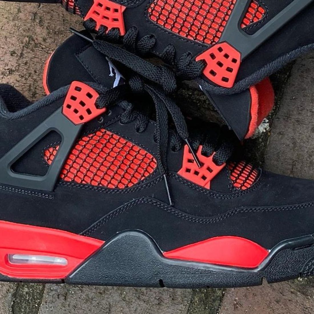 1100x1100 In Hand Look At The Air Jordan 4 'Red Thunder', Phone