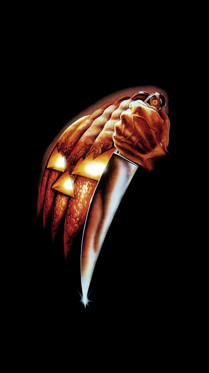 700x1250 poster for the movie halloween scary halloween wallpaper jack o lantern mask and knife on black. Halloween wallpaper, Halloween desktop wallpaper, Scary halloween, Phone