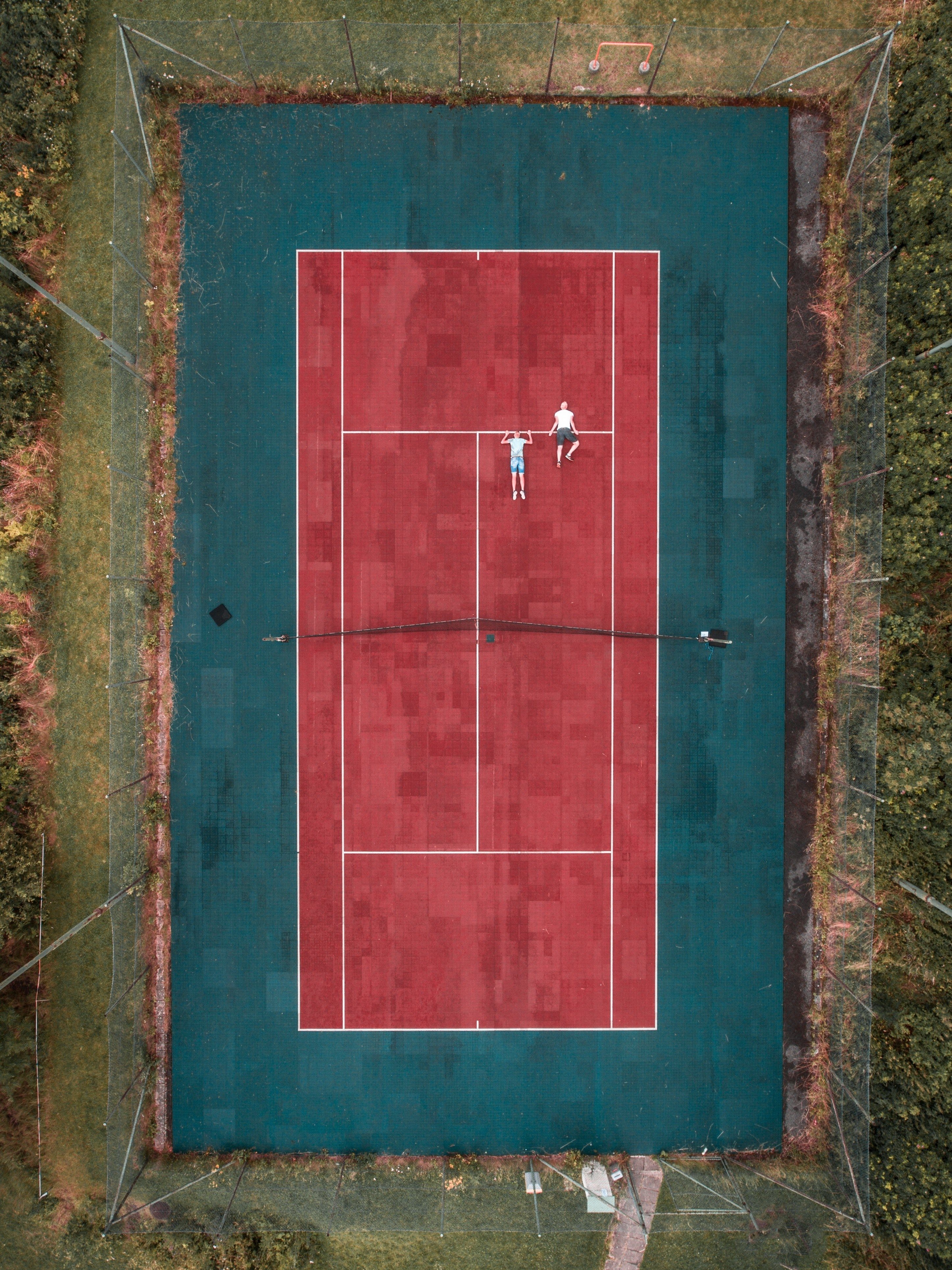 2900x3860 Wallpaper / a drone looking down at an outdoor tennis, Phone