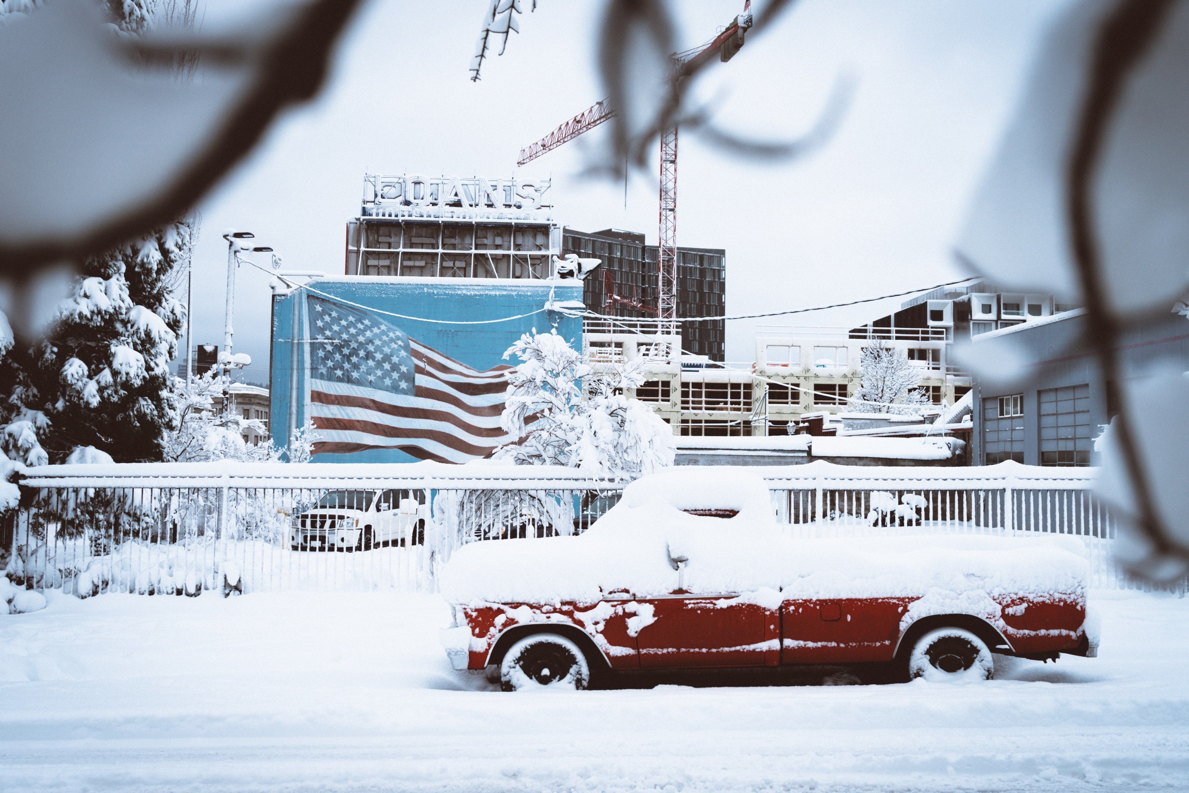 3840x2560 Wallpaper / red truck covered in snow at a harbor in portland, snow days 4k wallpaper, Desktop