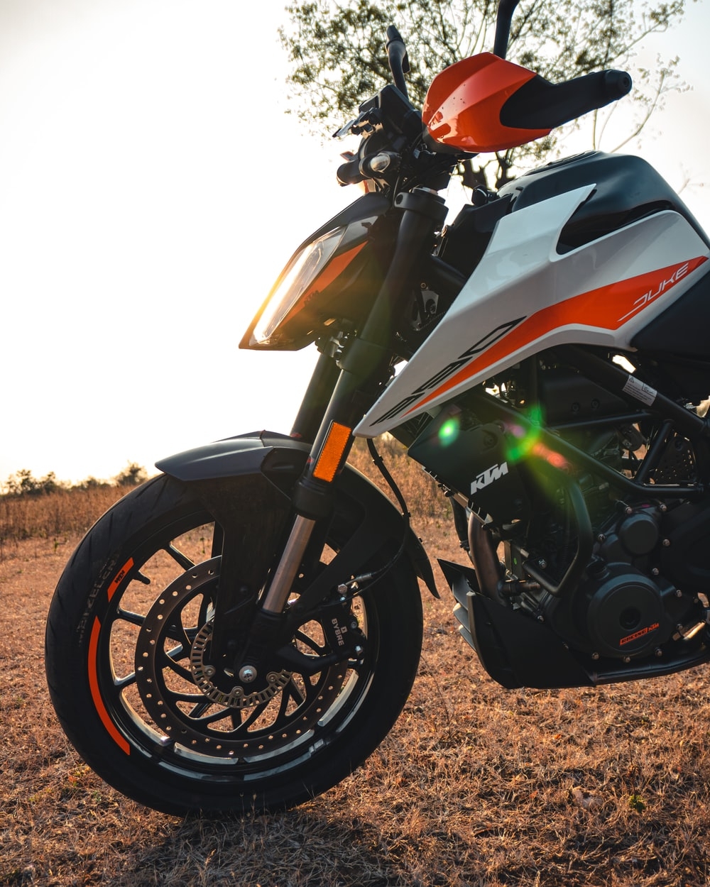 1000x1250 red and white sports bike on brown field during daytime photo, Phone