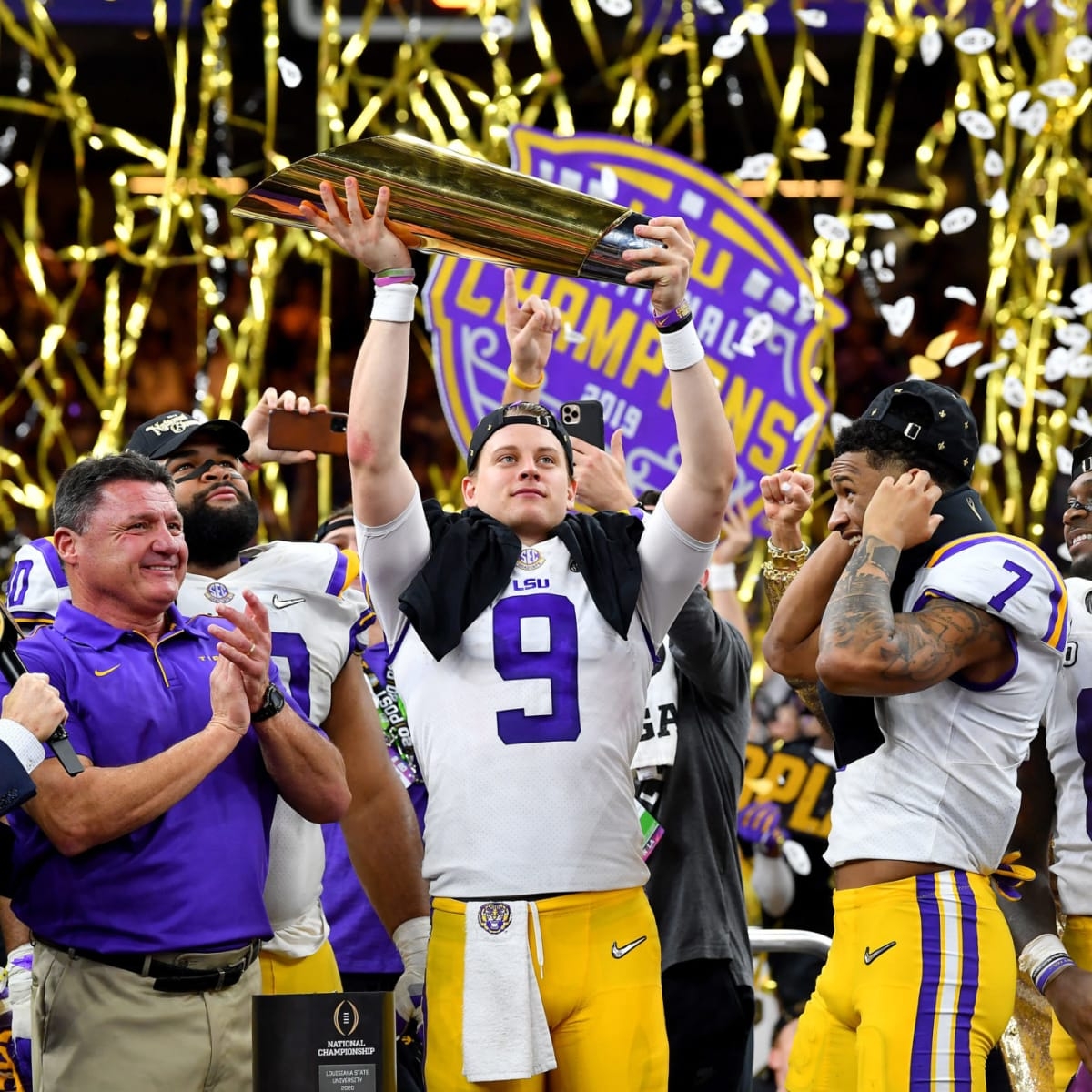 1200x1200 Joe Burrow LSU Tigers Unsigned White Jersey Posting LSU Sticker on National Championship Bracket Photograph, Phone