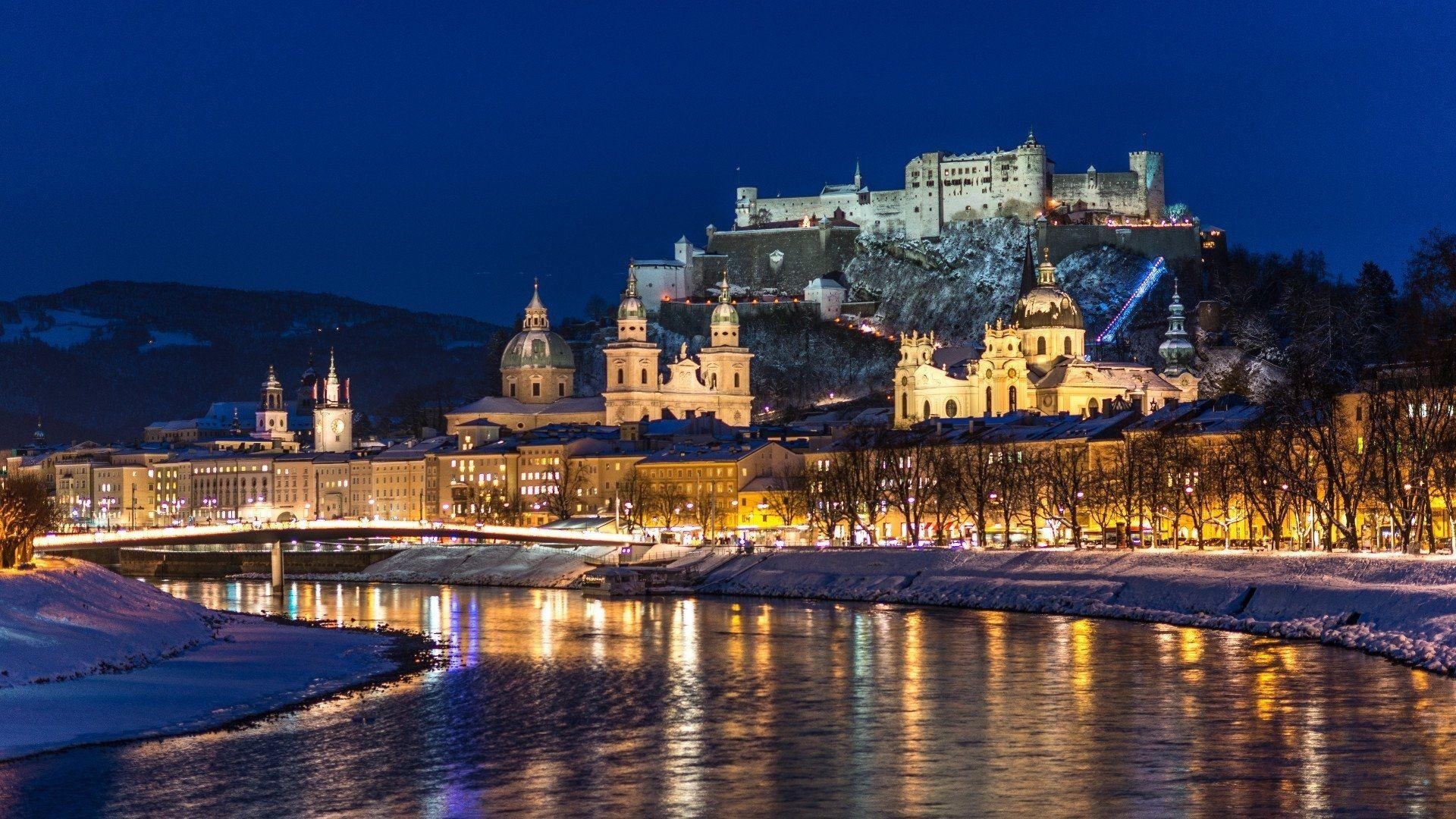 1920x1080 City night, Salzburg, Austria, river, winter, snow, houses, lights, Desktop