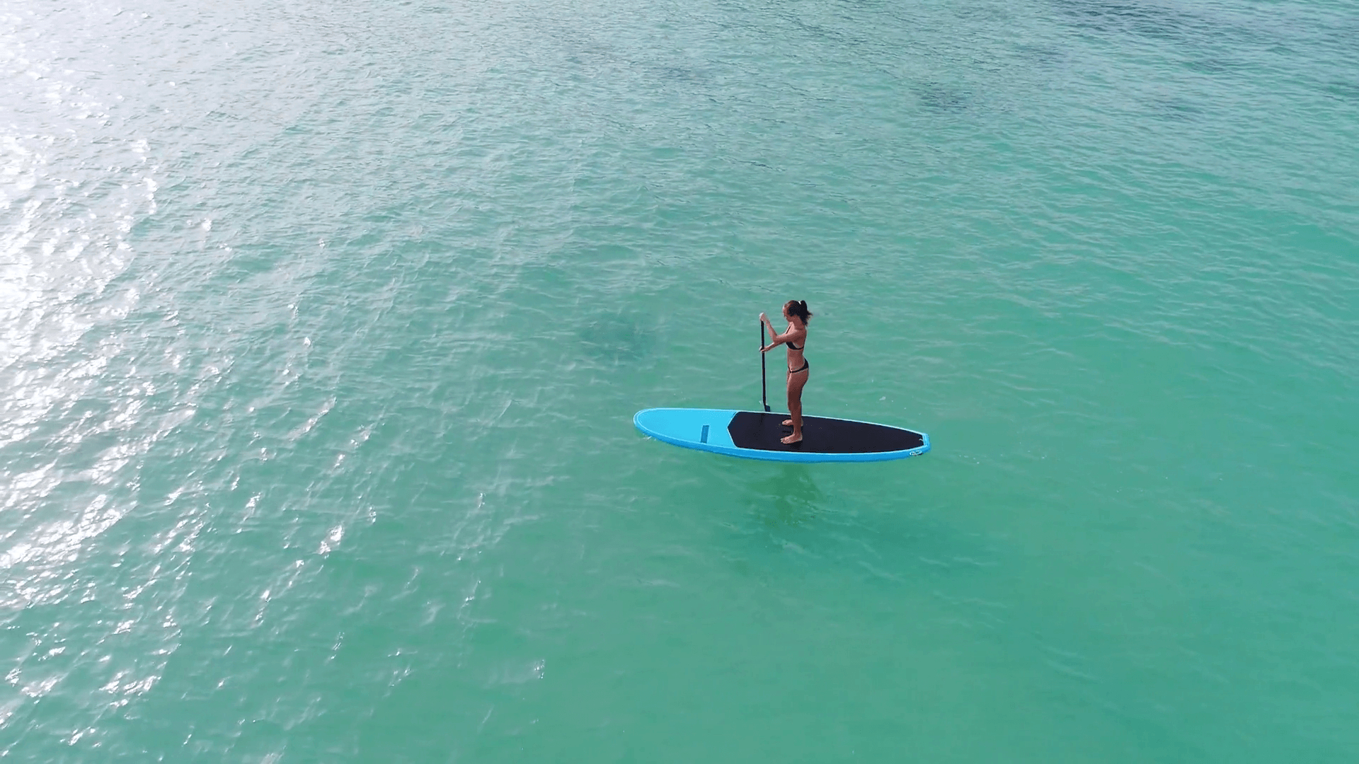 1920x1080 Aerial drone bird's eye view of man exercising sup paddle board, Desktop