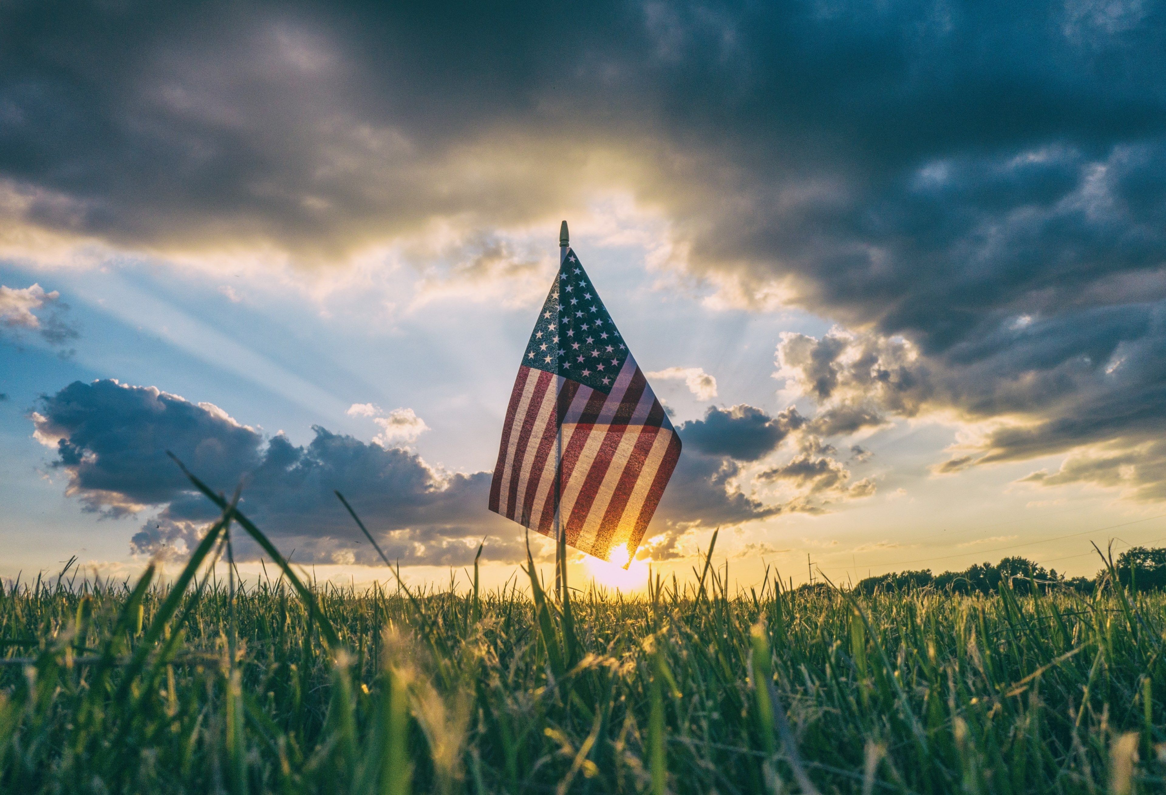 3840x2620 Wallpaper / the flag of america stands in the grass with looming sunnset on 4th of july, american flag in the grass 4k wallpaper, Desktop