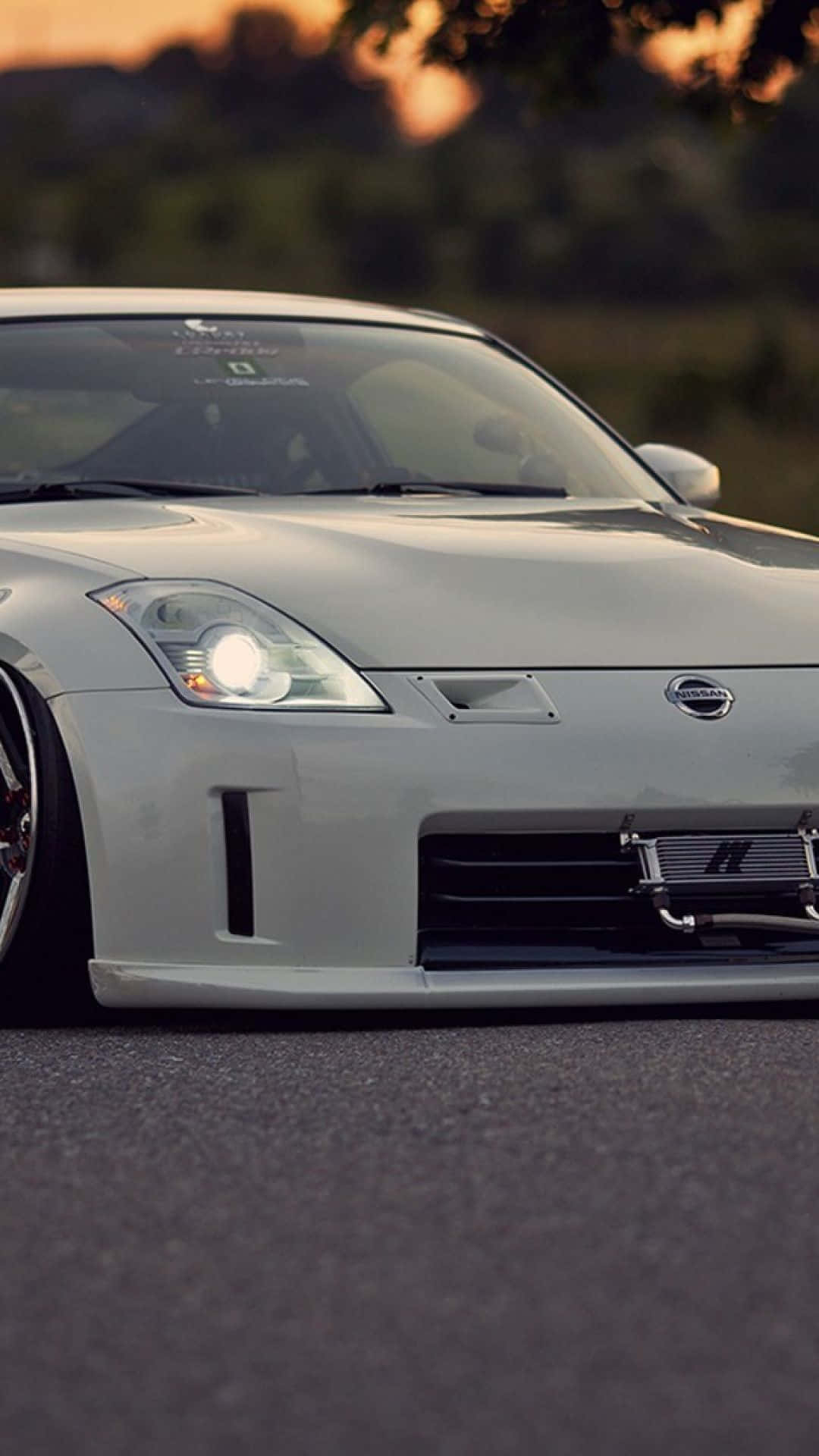 1080x1920 Download Take your driving experience to the next level with the Nissan 350z! Wallpaper, Phone