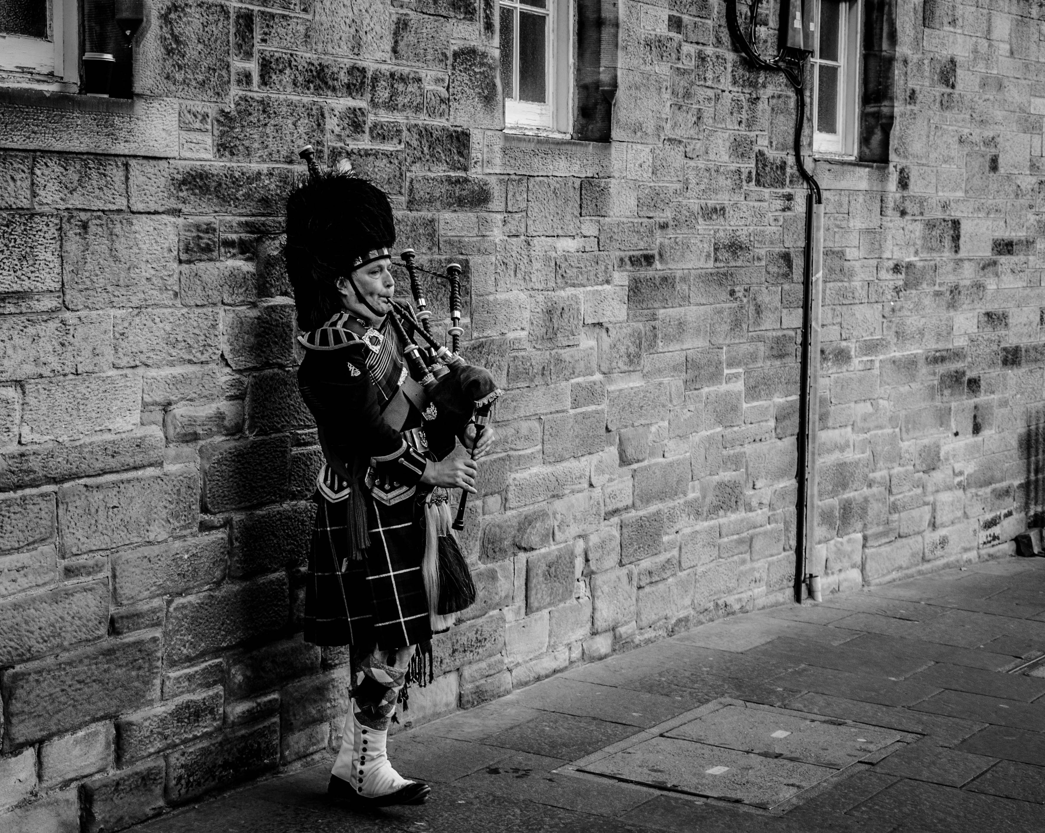 3550x2830 Person Using Bagpipes Near Wall in Grayscale Photography · Free, Desktop