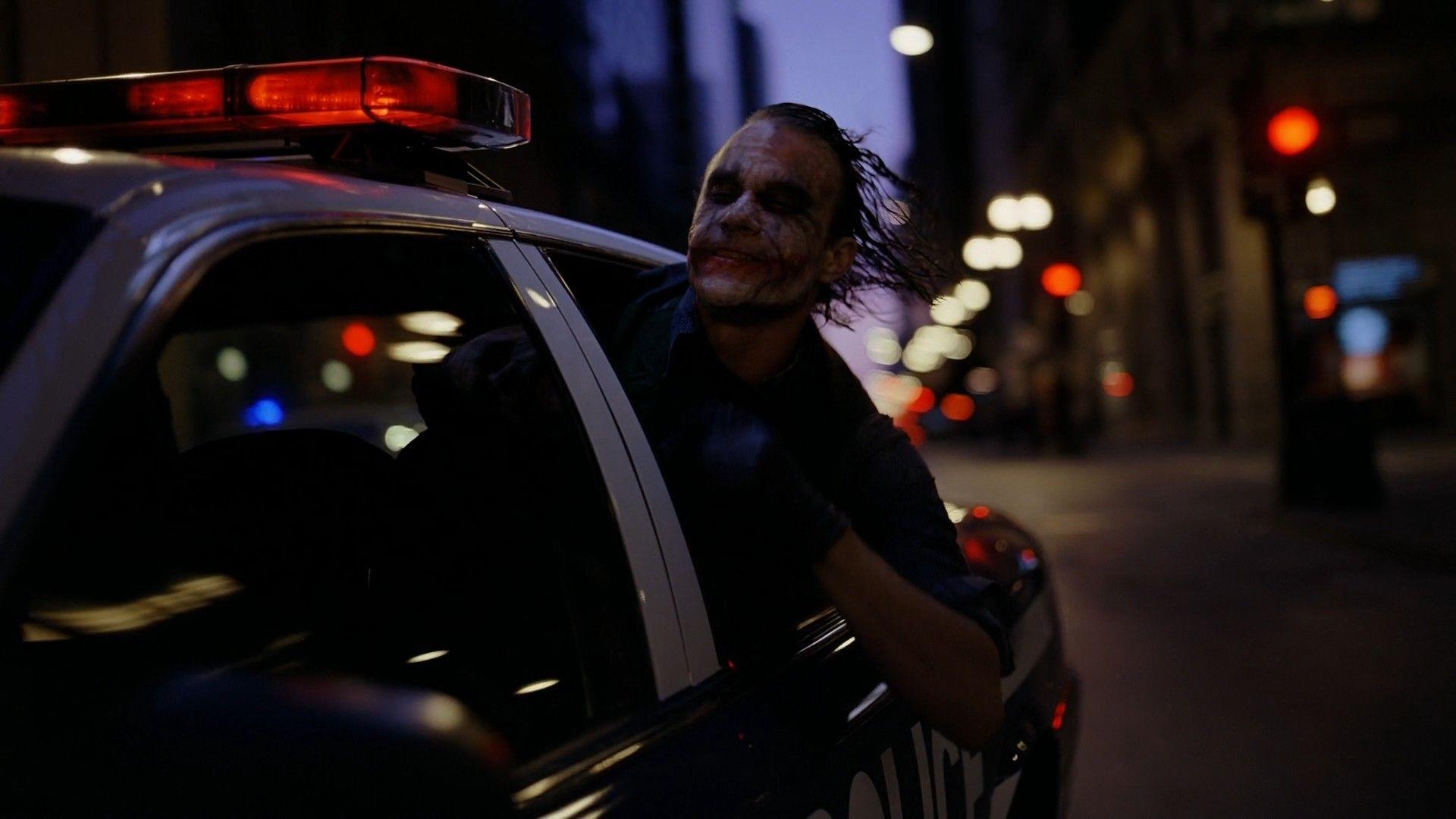 1920x1080 The Joker, Heath Ledger, police cars, Batman The Dark Knight, cities, Desktop