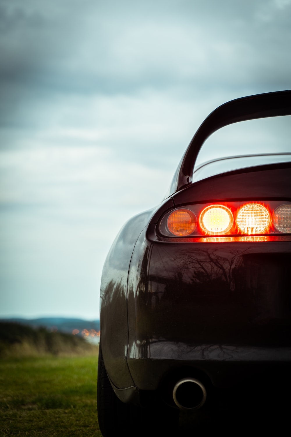 1000x1500 Black car with orange light photo, Phone