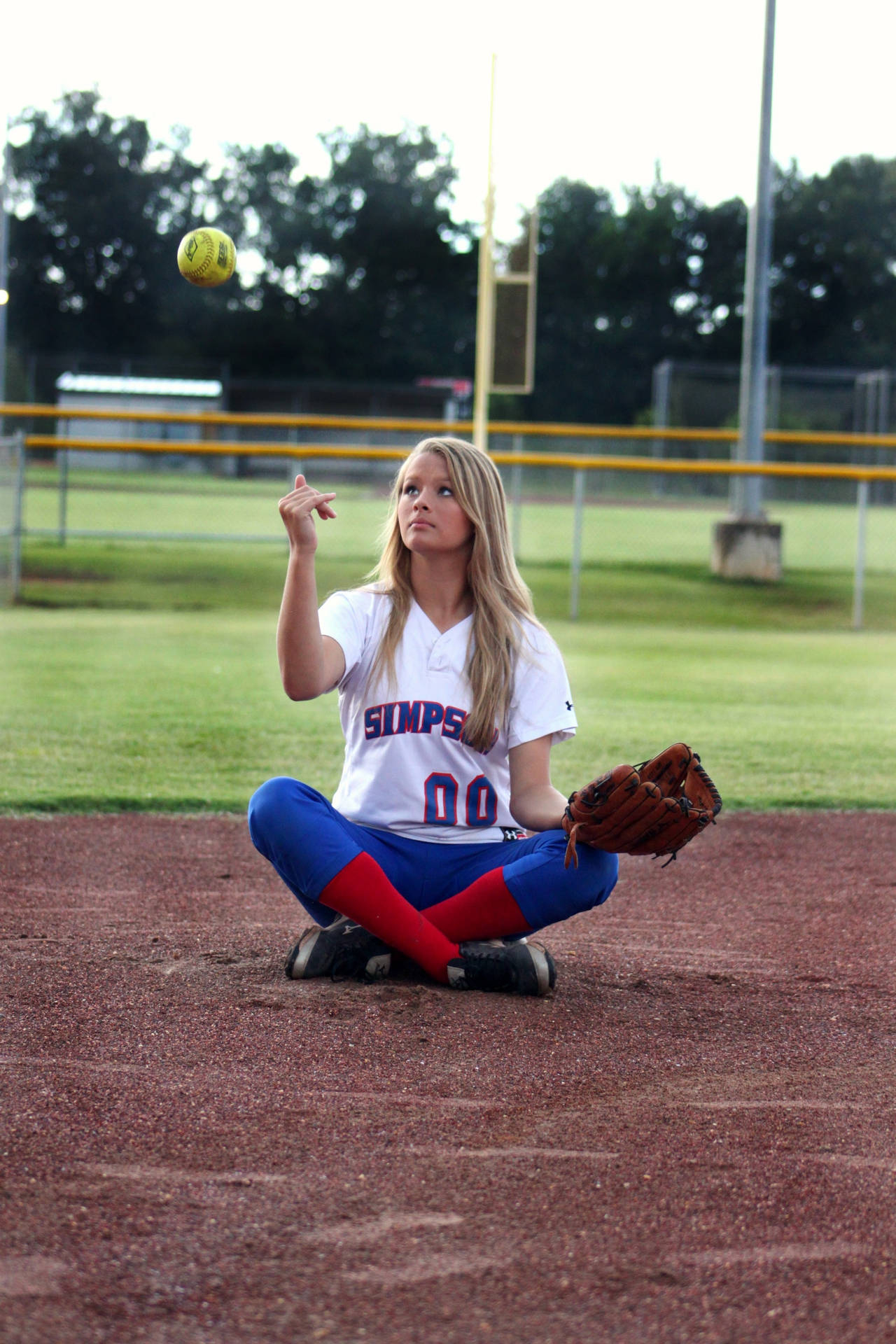 1280x1920 Download Softball Player Throwing The Ball Wallpaper, Phone