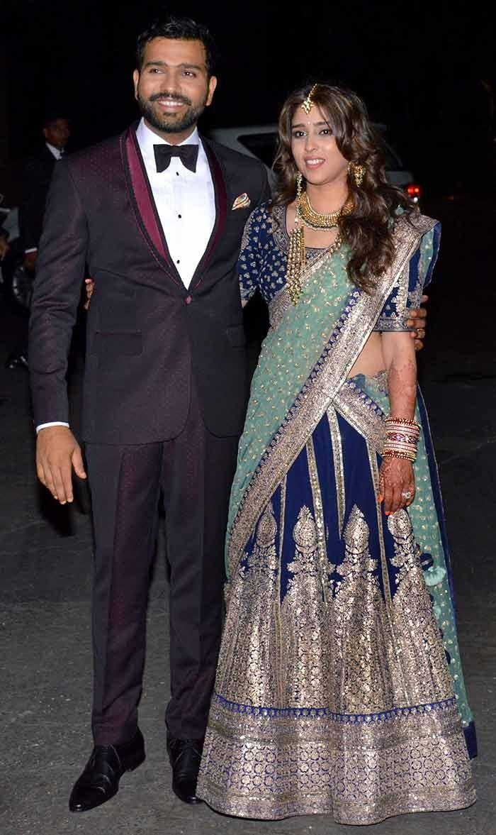 700x1180 Rohit Sharma and Ritika Sajdeh clicked during their reception, Phone