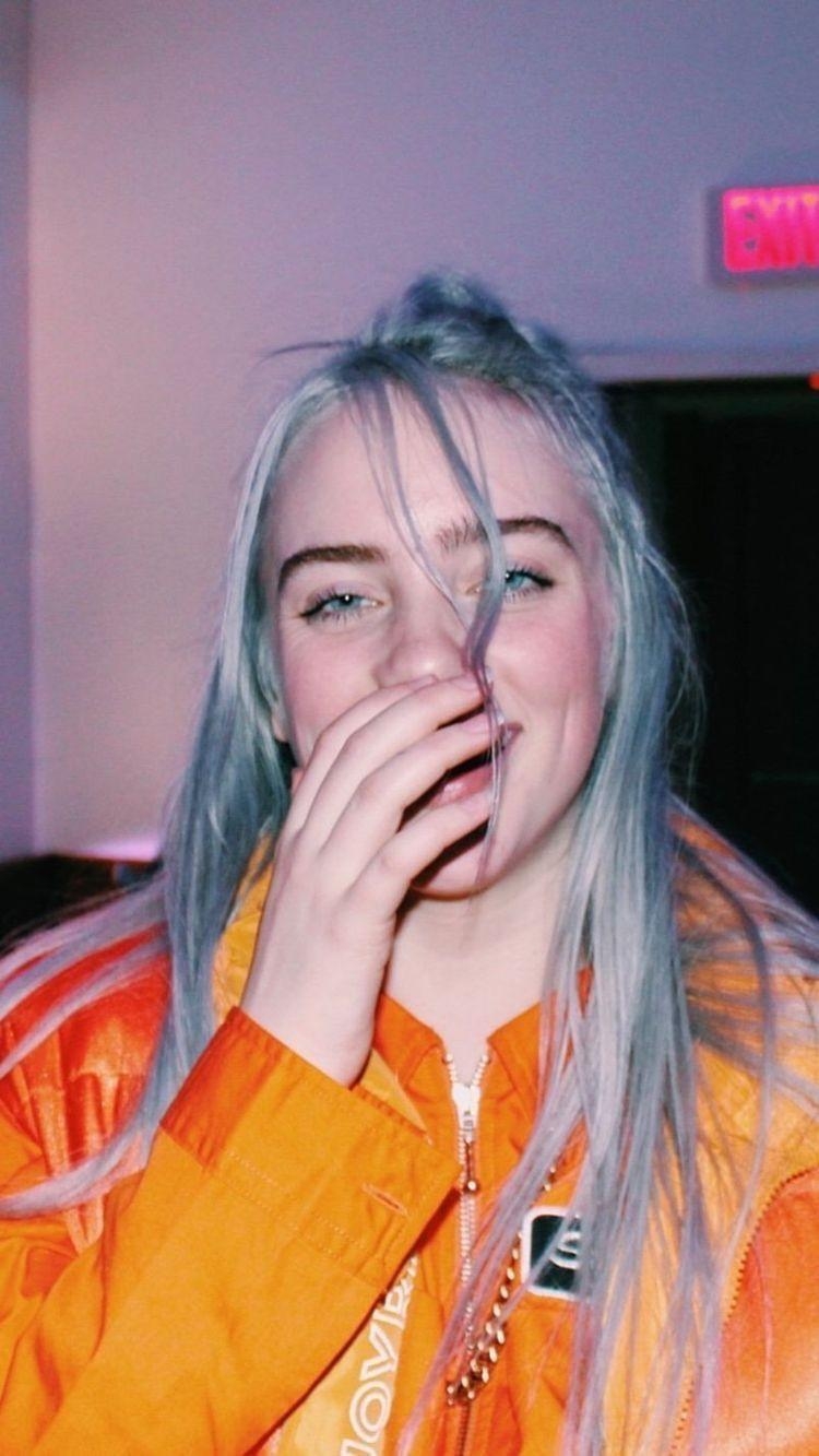 750x1340 Billie Eilish Smiling Wallpaper, Phone